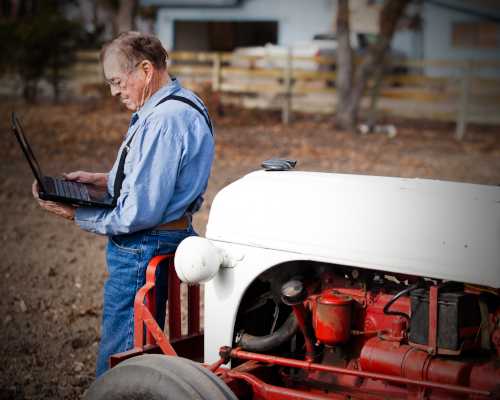 Farmer Using Laptop Computer 500x400v
